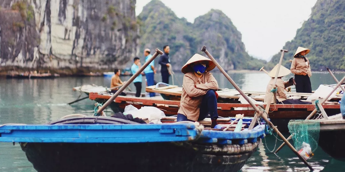 People in hats in boats on Halong Bay, Vietnam, Asia